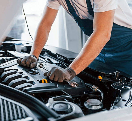 mechanic fixing car parts