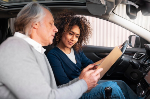 Roadworthy Certificate inspection with mechanic and driver in car